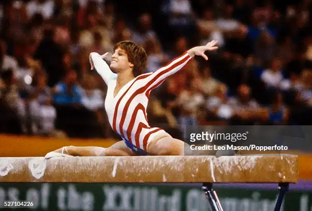 American gymnast Mary Lou Retton pictured in action on the balance beam during competition in the Women's artistic individual all-around event at the 1984 Summer Olympics inside the Pauley Pavilion in Los Angeles, United States in July 1984. Mary Lou Retton would go on to win the gold medal in the final round of this event on 3rd August. (Photo by Leo Mason/Popperfoto via Getty Images)
